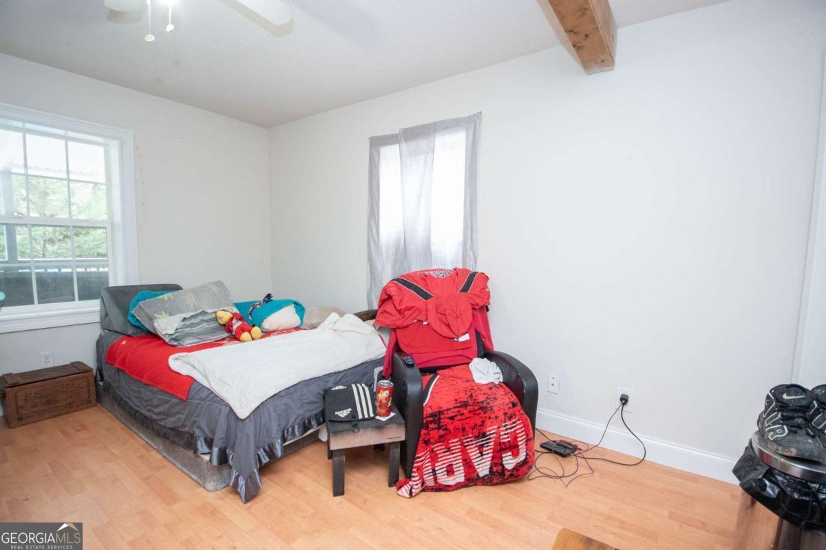 134 Rustica Drive Newnan, GA 30263 - Photo 20 of 32 a bedroom with a bed and window