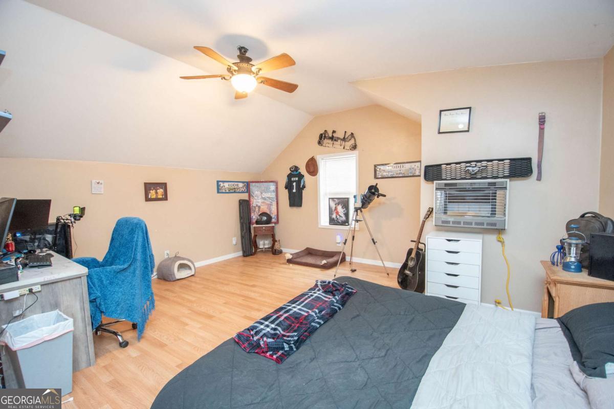 134 Rustica Drive Newnan, GA 30263 - Photo 21 of 32 a bedroom with furniture and a bed