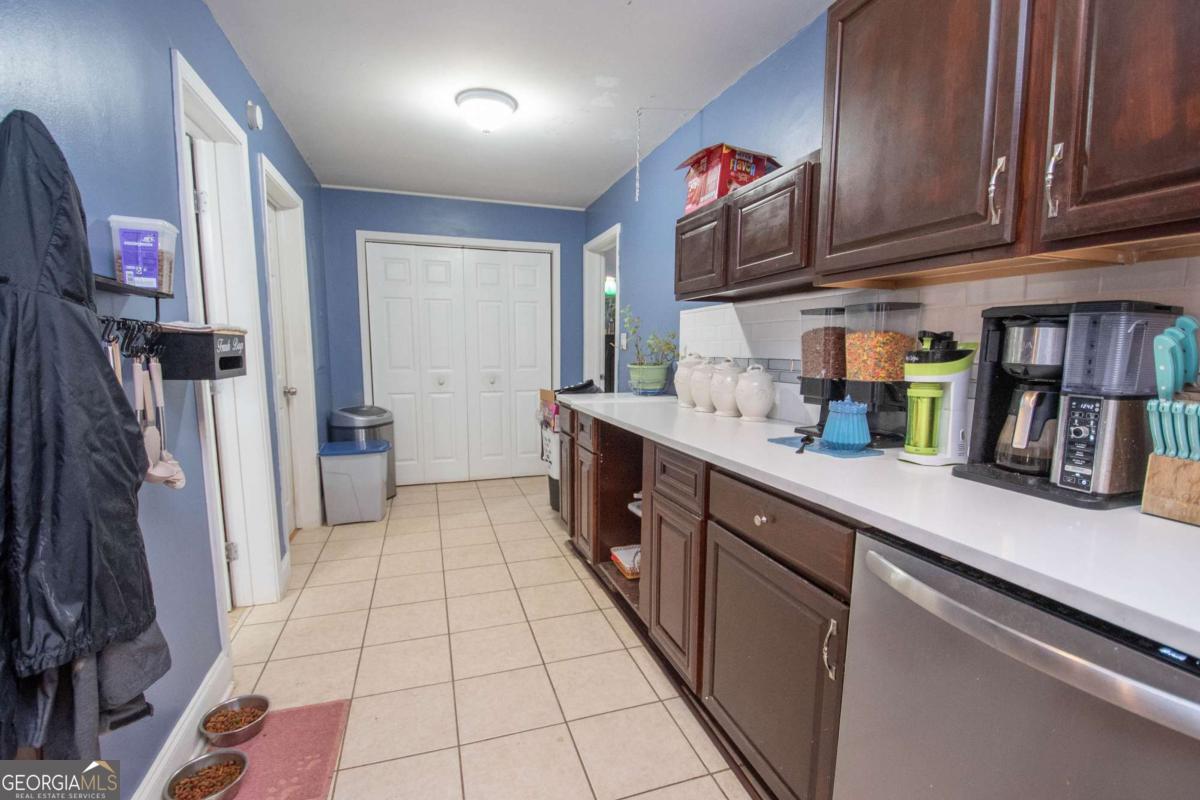 134 Rustica Drive Newnan, GA 30263 - Photo 9 of 32 a kitchen with stainless steel appliances granite countertop a refrigerator a sink and dishwasher