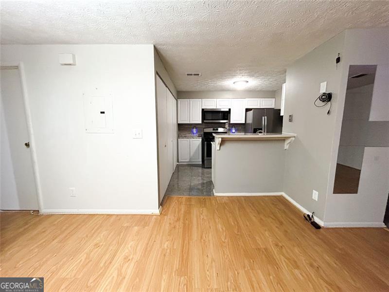 6379 Wedgeview Court Tucker, GA 30084 - Photo 4 of 16 a view of a kitchen with wooden floor