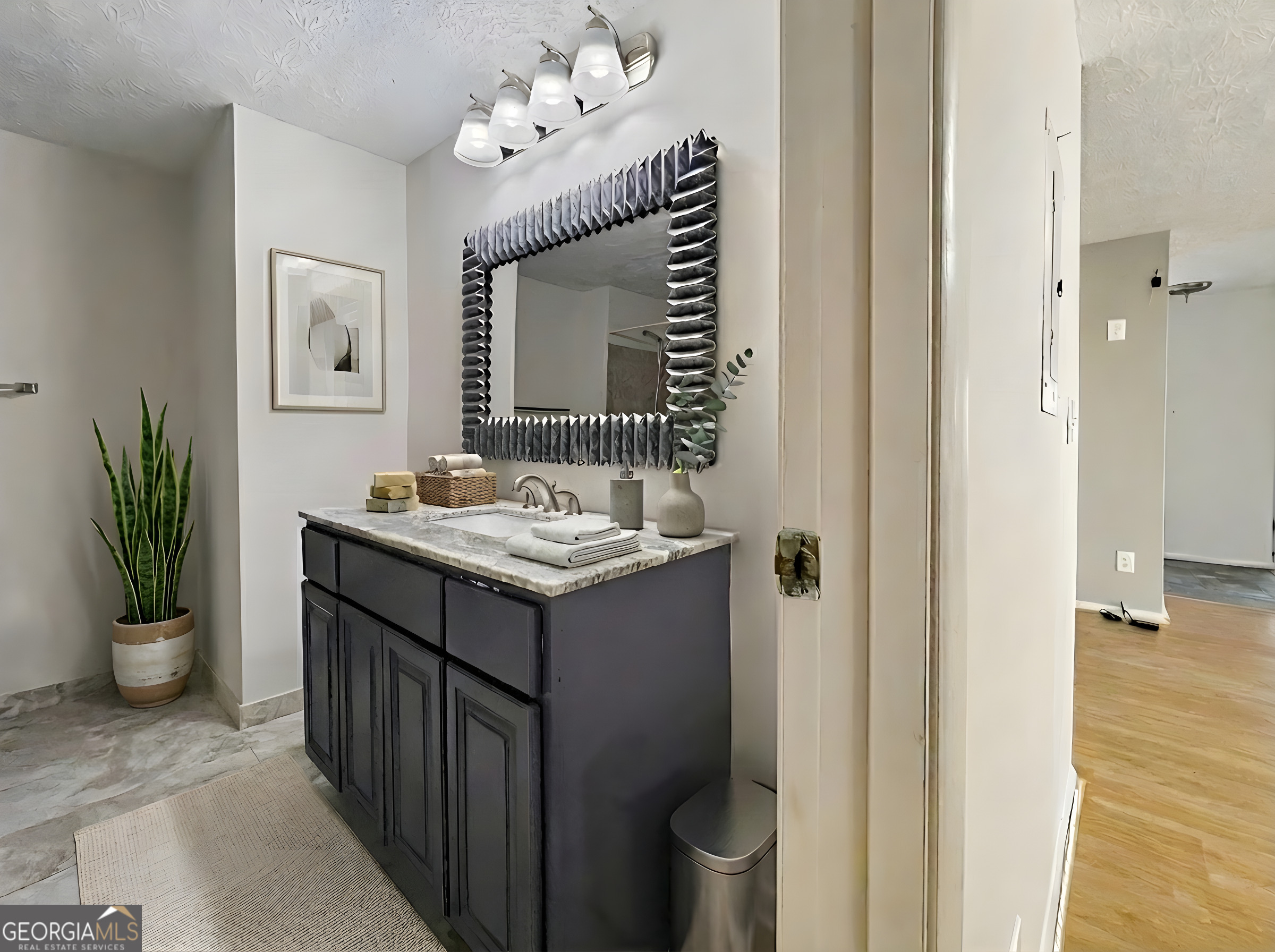 6379 Wedgeview Court Tucker, GA 30084 - Photo 10 of 16 a bathroom with a sink and a mirror