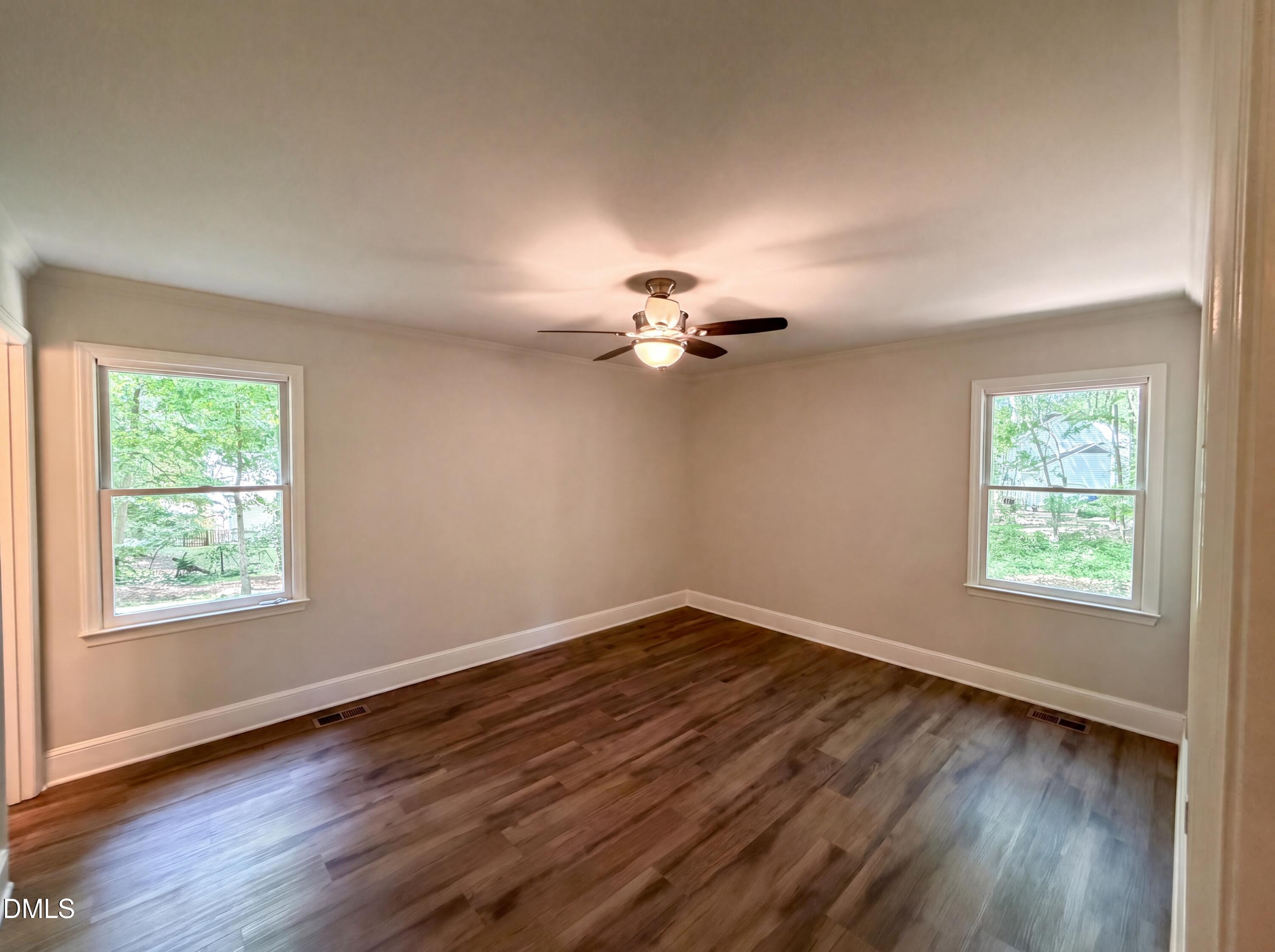 102 Lakeside Farm Road Zebulon, NC 27597 - Photo 12 of 18 a view of a room with wooden floor fan and window