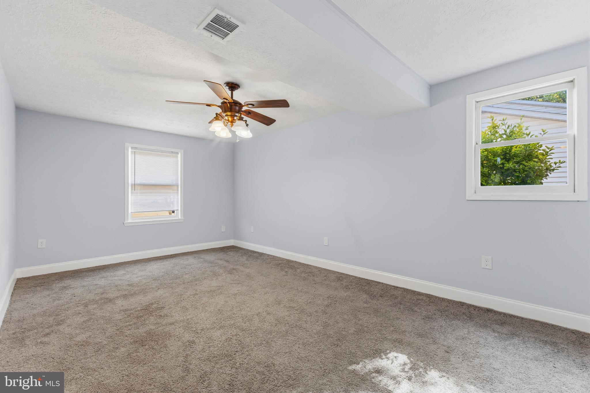 119 Jefferson Road Waldorf, MD 20602 - Photo 31 of 40 an empty room with windows and fan