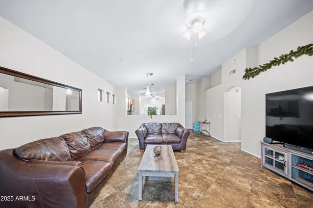 a spacious bathroom with a double vanity sink and a mirror