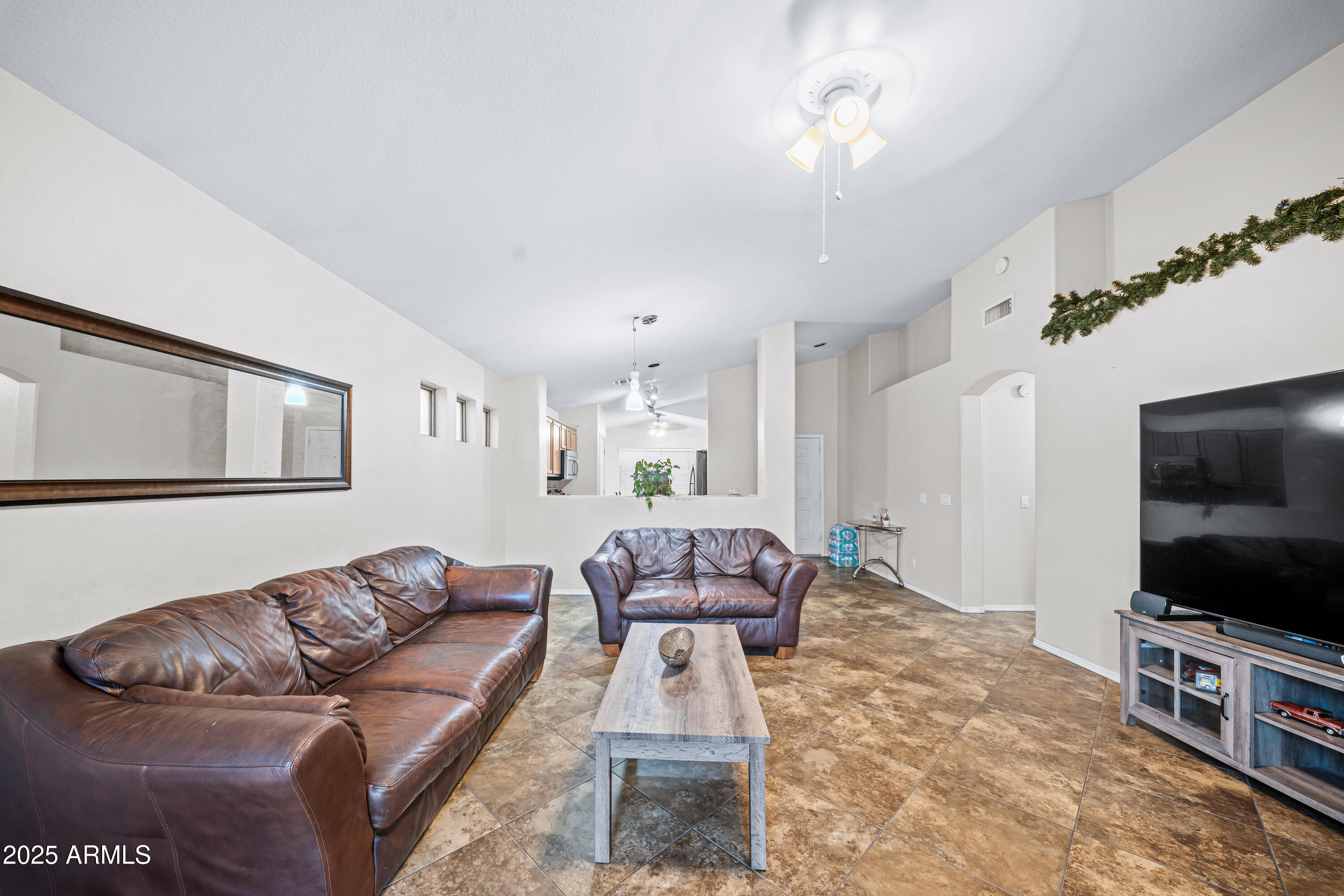 1428 West Mesquite Avenue Apache Junction, AZ 85120 - Photo 8 of 16 a living room with furniture and a flat screen tv