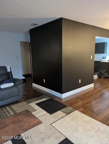 a living room with a couch and a flat screen tv