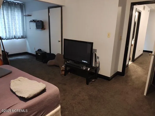 a room with furniture and a flat screen tv