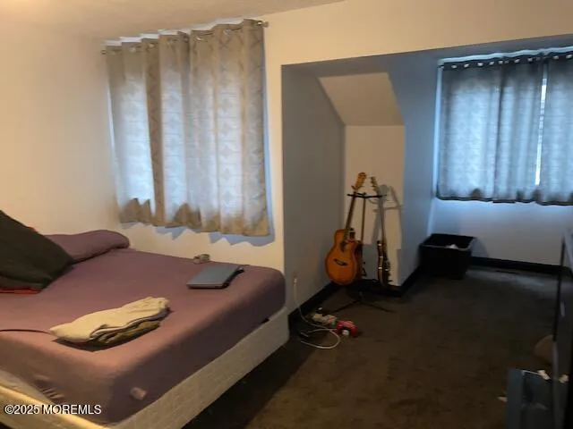 a bed room with a bed and a couch