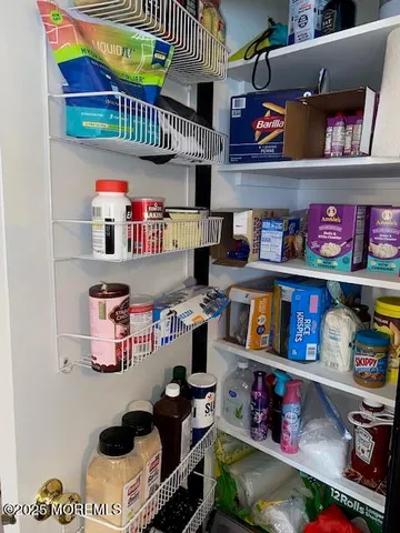 a store room with lots of furniture and clutter