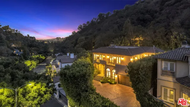 a large spacious bathroom with a tub shower sink and mirror