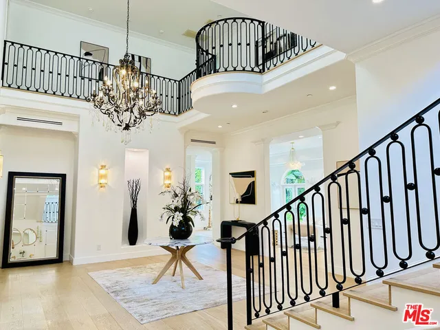 a view of staircase with a potted plant on a table
