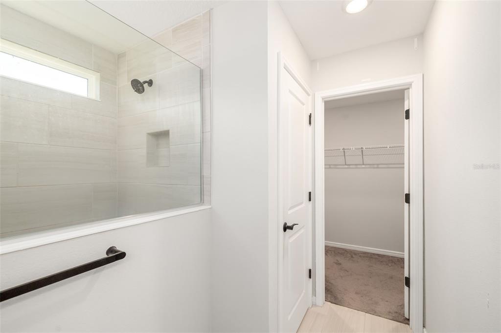 9406 Lamine Way Parrish, FL 34219 - Photo 15 of 74 a bathroom with a shower