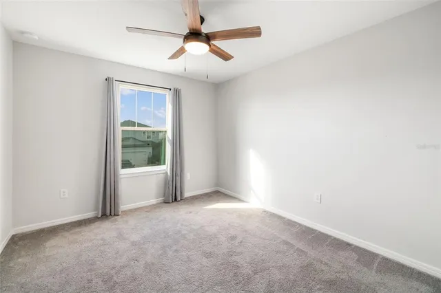 a bathroom with a double vanity sink a mirror and a shower