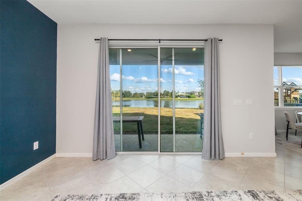 9406 Lamine Way Parrish, FL 34219 - Photo 37 of 74 a view of an empty room with glass door and a window
