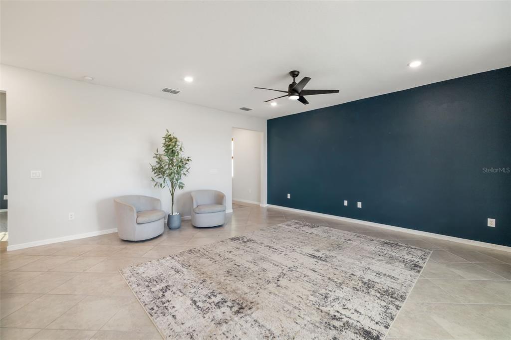 9406 Lamine Way Parrish, FL 34219 - Photo 44 of 74 a living room with furniture and a potted plant