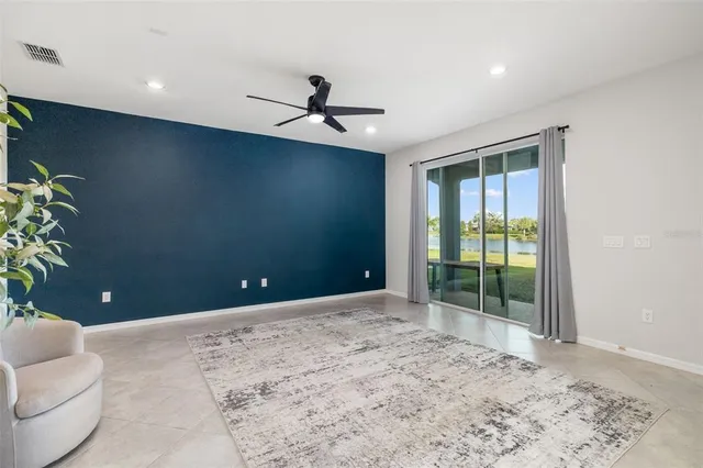 an aerial view of house with yard and green space