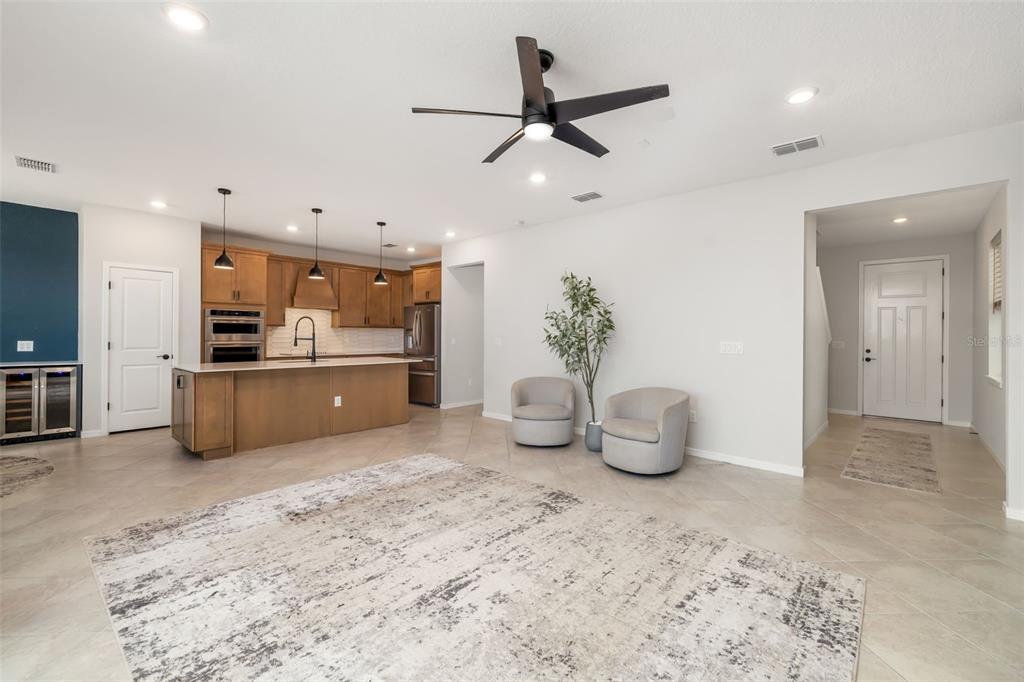 9406 Lamine Way Parrish, FL 34219 - Photo 5 of 74 a kitchen with kitchen island a sink stainless steel appliances and cabinets