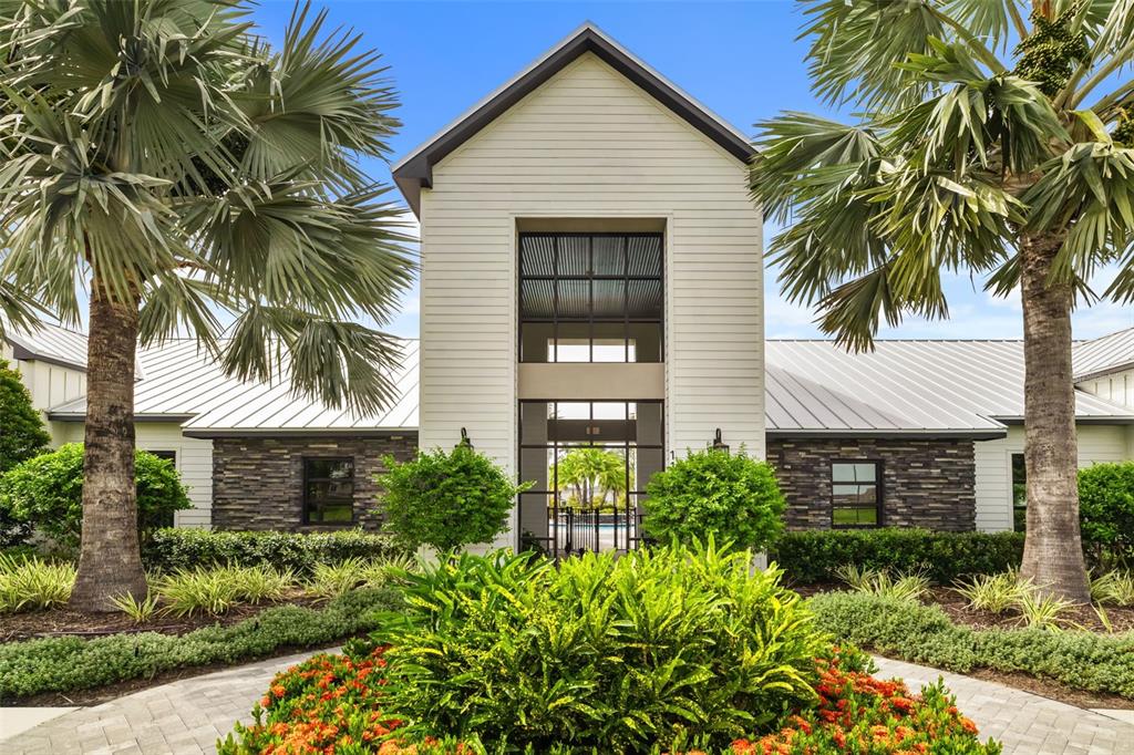 9406 Lamine Way Parrish, FL 34219 - Photo 58 of 74 a front view of a house with a garden