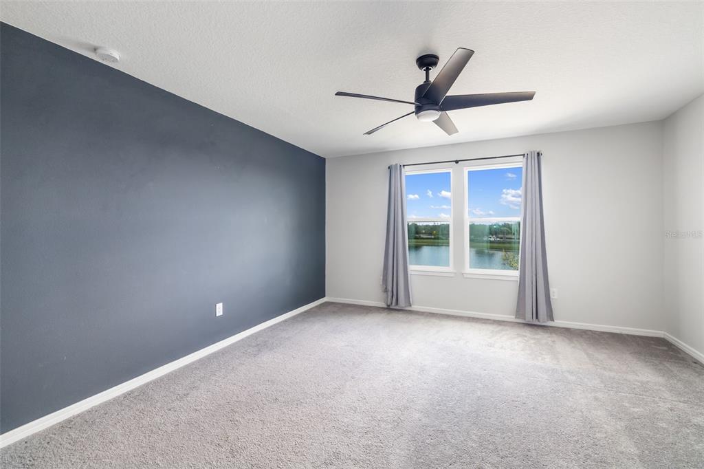 9406 Lamine Way Parrish, FL 34219 - Photo 10 of 74 a view of room with ceiling fan and window