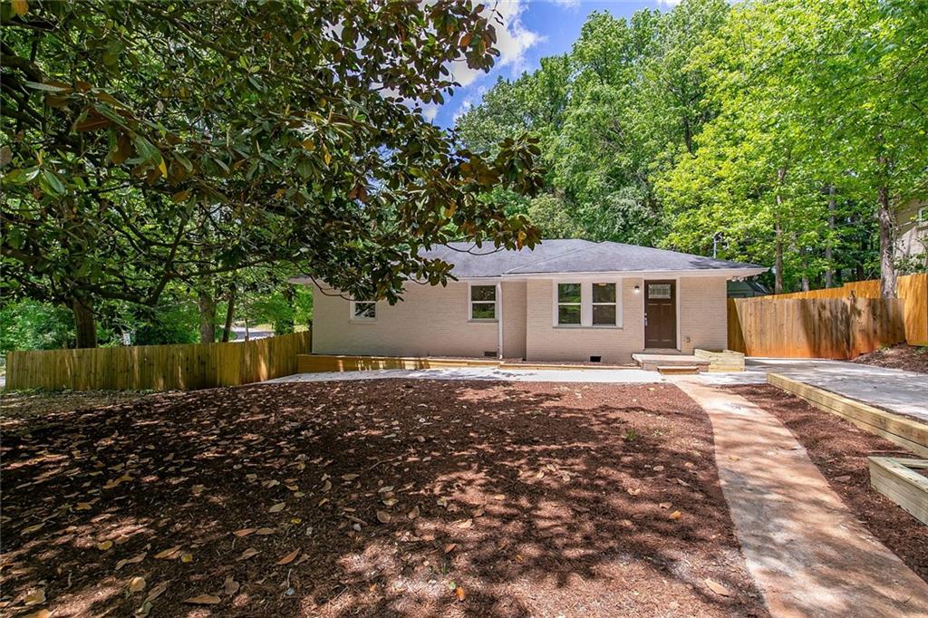 1693 Hollyhock Terrace Decatur, GA 30032 - Photo 1 of 1 a front view of a house with a garden