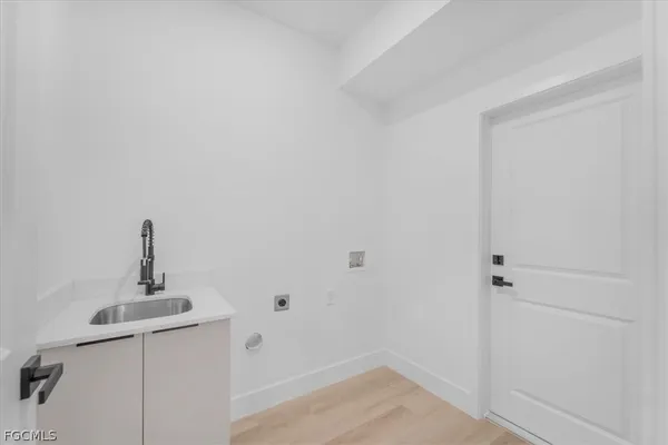 a bathroom with a sink a mirror and shower