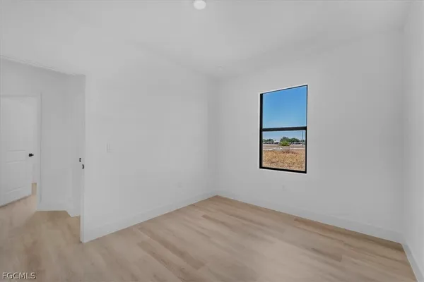 a view of an empty room and window