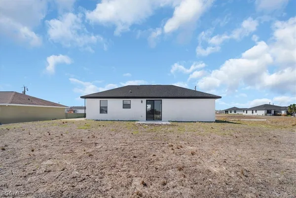 a house with trees in the background