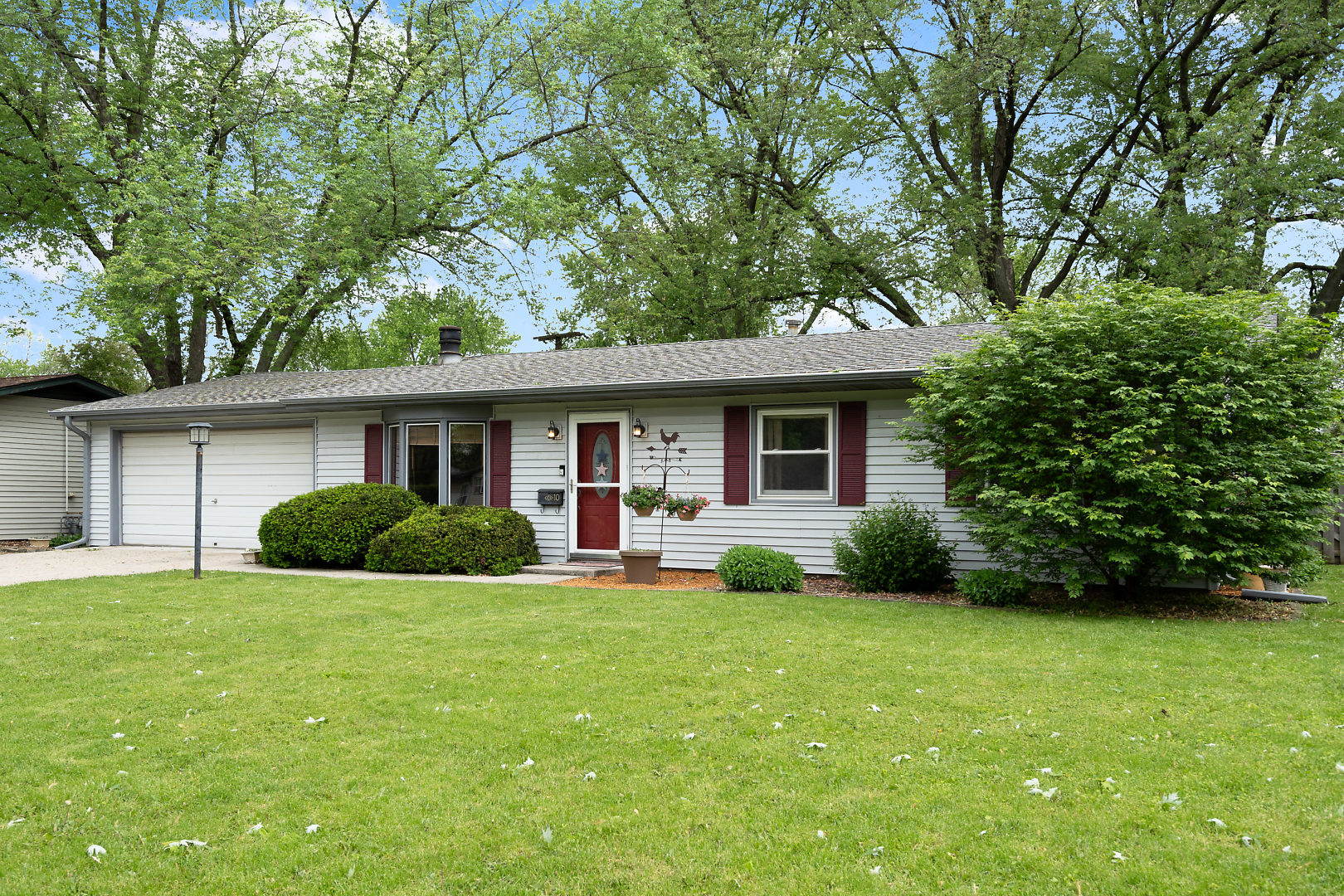10 Durango Road Montgomery, IL 60538 - Photo 2 of 21 a view of a house with a yard and potted plants large tree