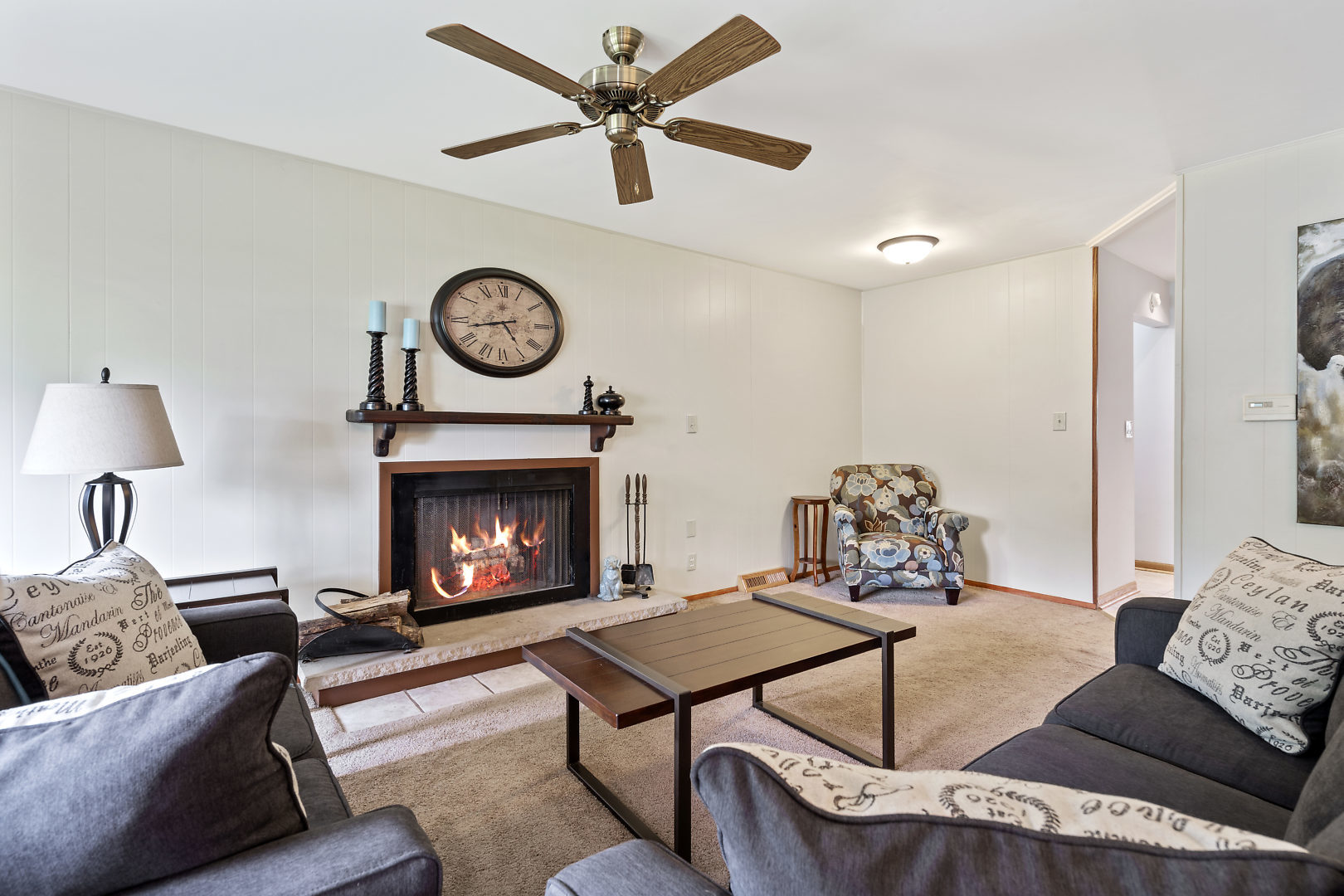 10 Durango Road Montgomery, IL 60538 - Photo 4 of 21 a living room with furniture a clock and a fireplace