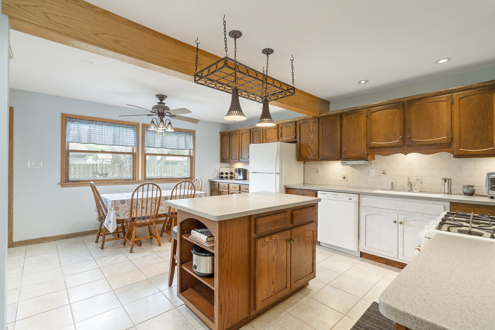 10 Durango Road Montgomery, IL 60538 - Photo 7 of 21 a kitchen with a stove a sink a refrigerator and wooden cabinets