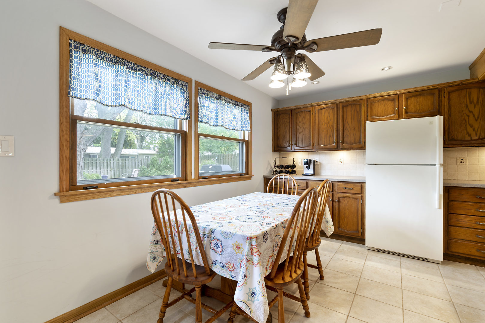 10 Durango Road Montgomery, IL 60538 - Photo 9 of 21 a dining room with furniture a window and a refrigerator