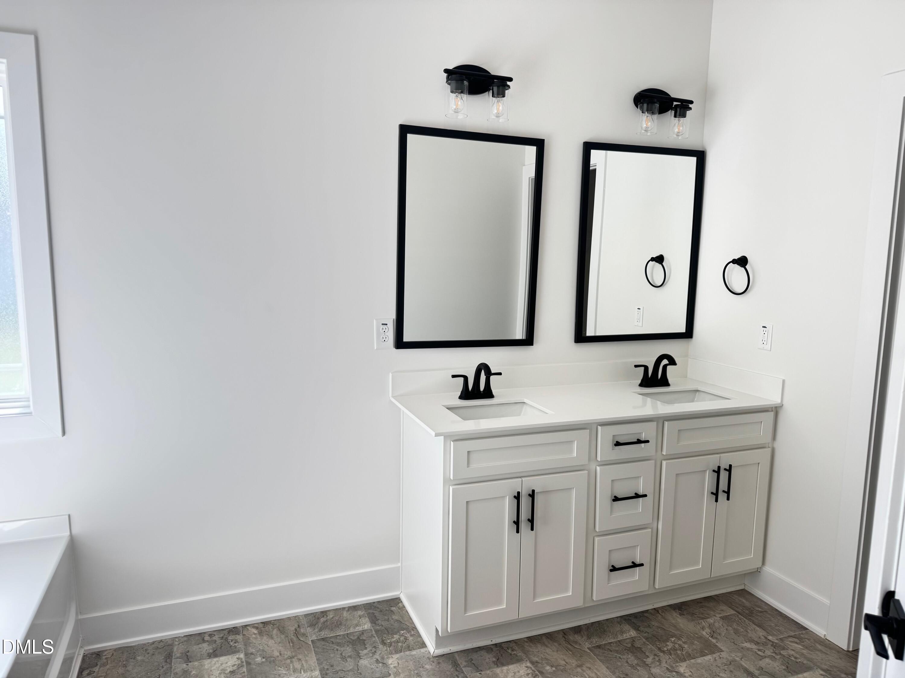20 Streamline Court Lillington, NC 27546 - Photo 24 of 46 a bathroom with 2 sink and a mirror