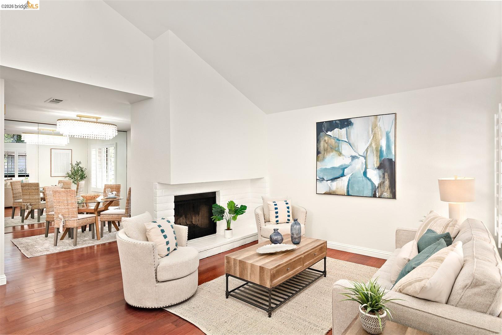806 Ironwood Road Alameda, CA 94502 - Photo 5 of 52 Living room featuring vaulted ceiling, hardwood / wood-style flooring, and a fireplace