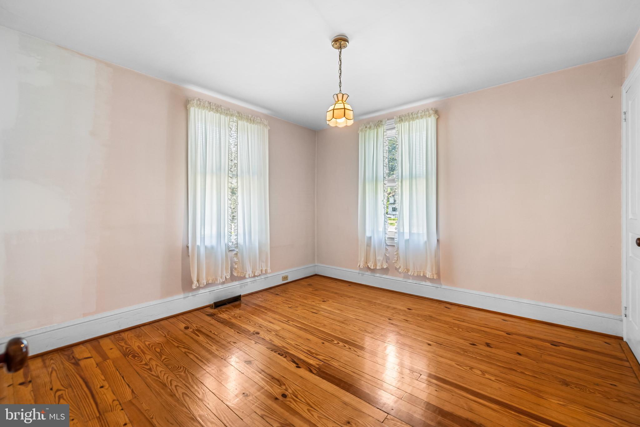 1053 Freeland Road Freeland, MD 21053 - Photo 20 of 31 wooden floor in an empty room with a window