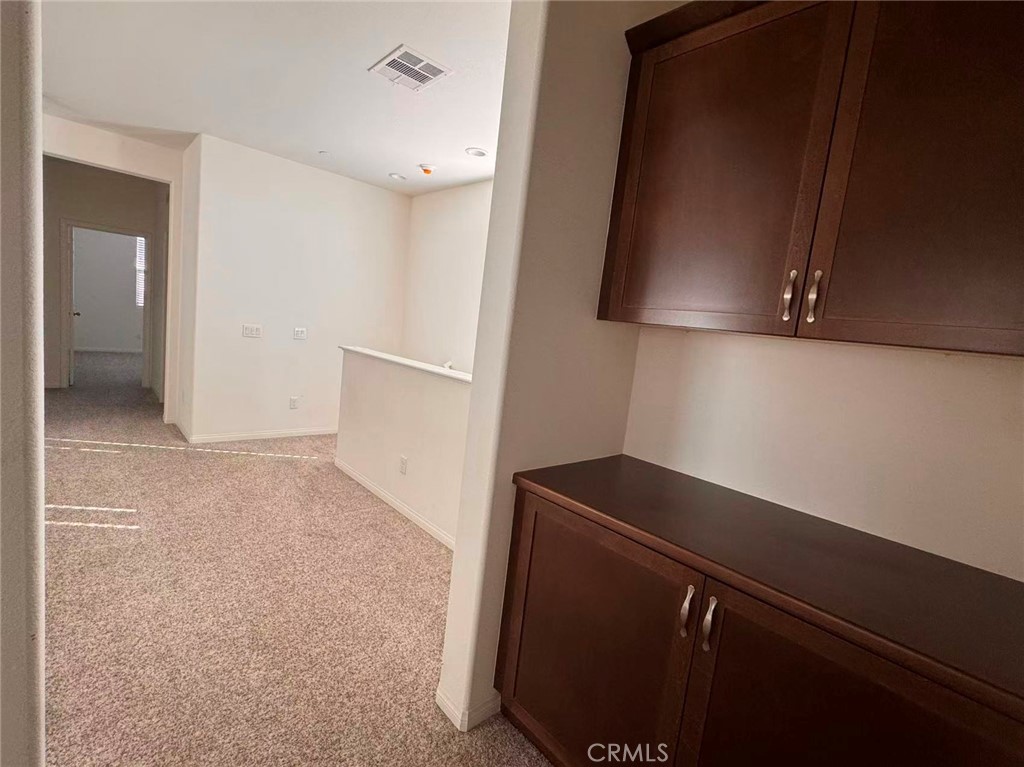 15767 Ralph Lane Fontana, CA 92336 - Photo 9 of 13 a view of storage and utility room with closet
