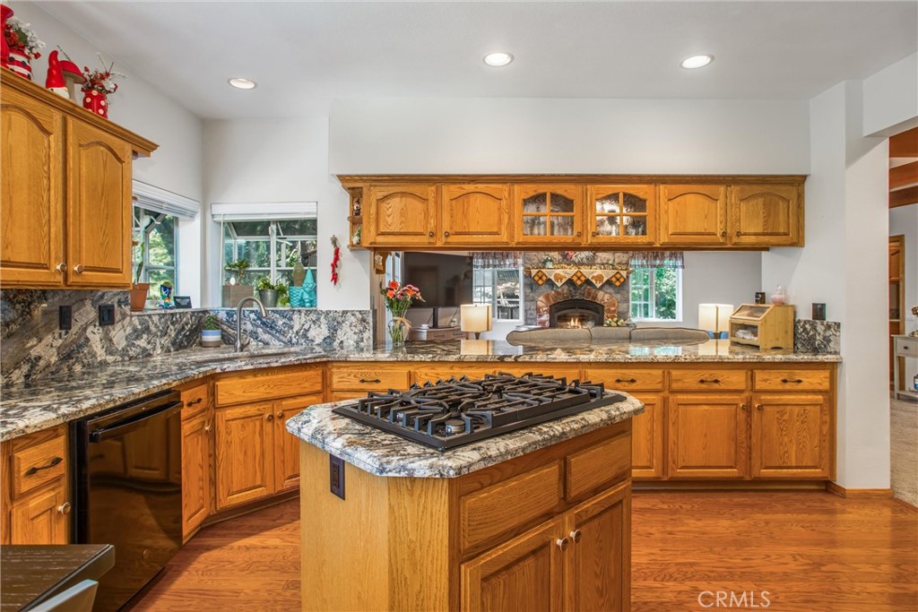6180 Cedar Avenue Angelus Oaks, CA 92305 - Photo 11 of 31 a kitchen with stainless steel appliances granite countertop a stove and a sink