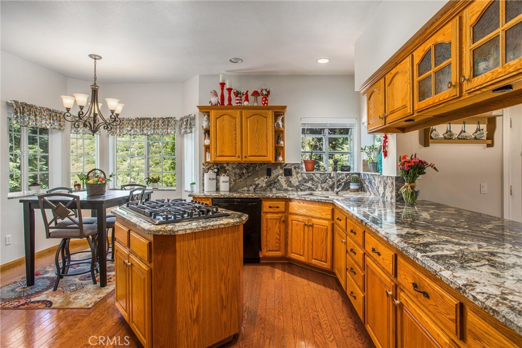 6180 Cedar Avenue Angelus Oaks, CA 92305 - Photo 13 of 31 a kitchen with stainless steel appliances granite countertop a stove and a sink