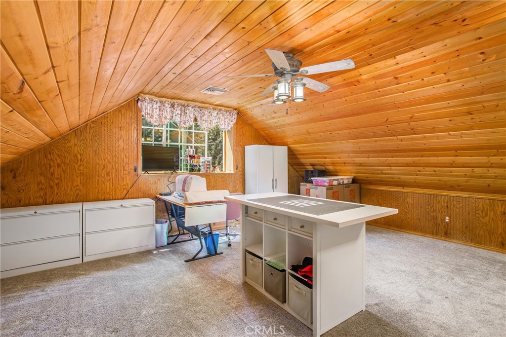 6180 Cedar Avenue Angelus Oaks, CA 92305 - Photo 18 of 31 a view of a room with furniture and a flat screen tv