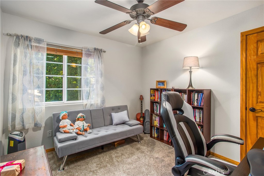 6180 Cedar Avenue Angelus Oaks, CA 92305 - Photo 19 of 31 a living room with furniture a rug and a window