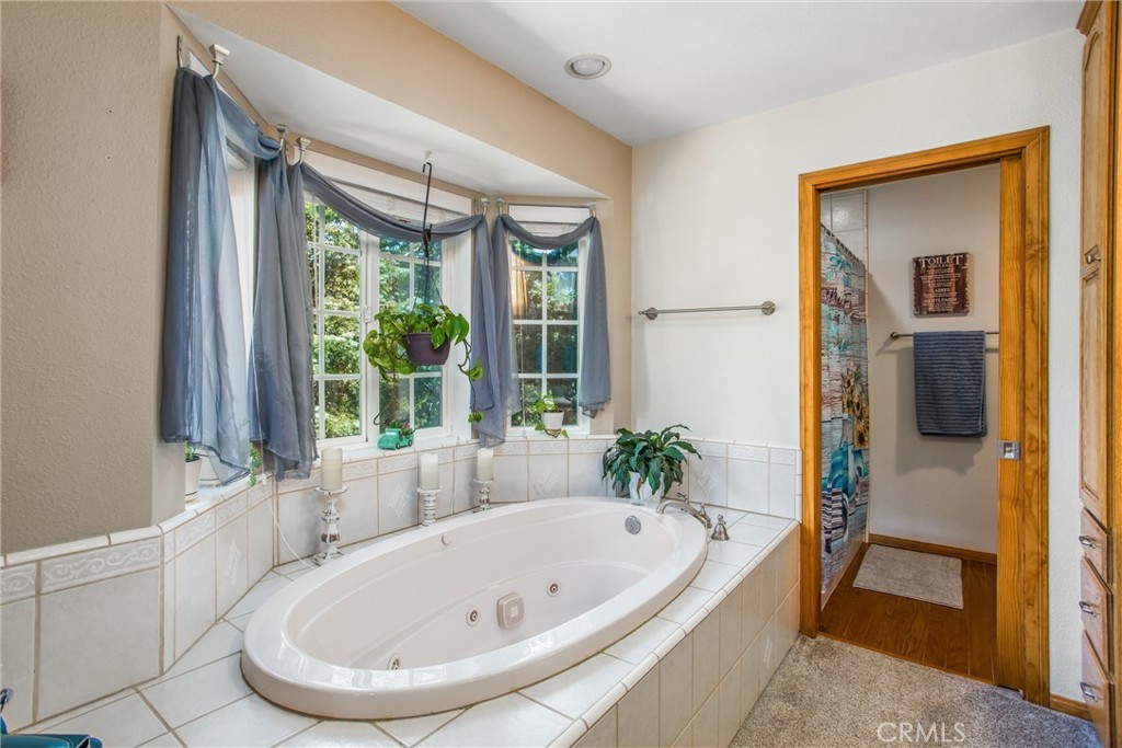6180 Cedar Avenue Angelus Oaks, CA 92305 - Photo 25 of 31 a bathroom with a tub and shower