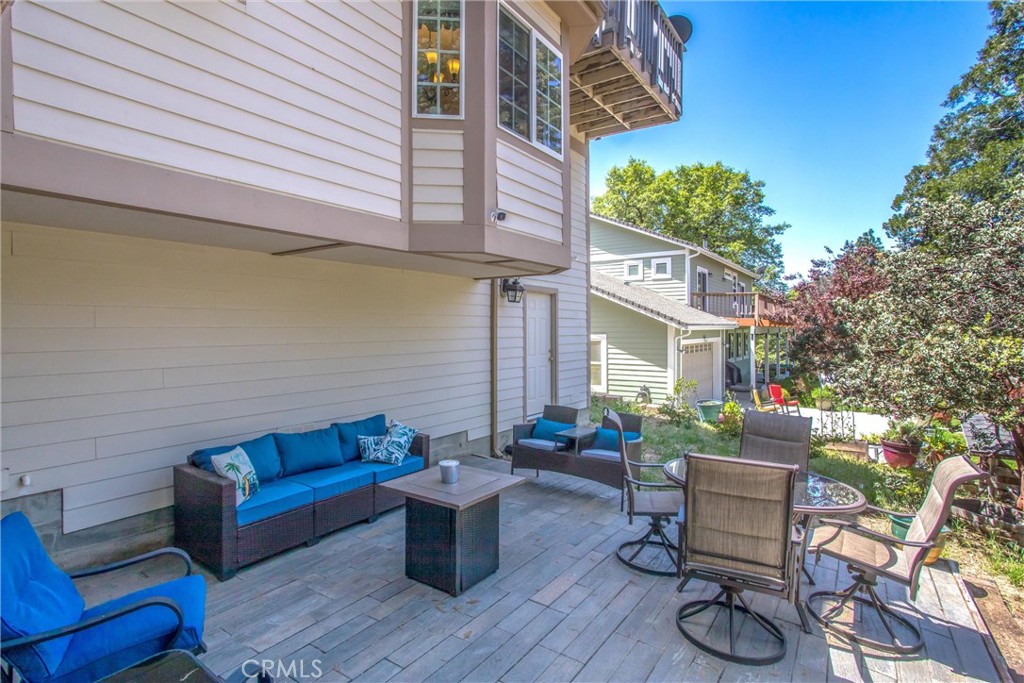 6180 Cedar Avenue Angelus Oaks, CA 92305 - Photo 27 of 31 a view of a patio with couches table and chairs and potted plants