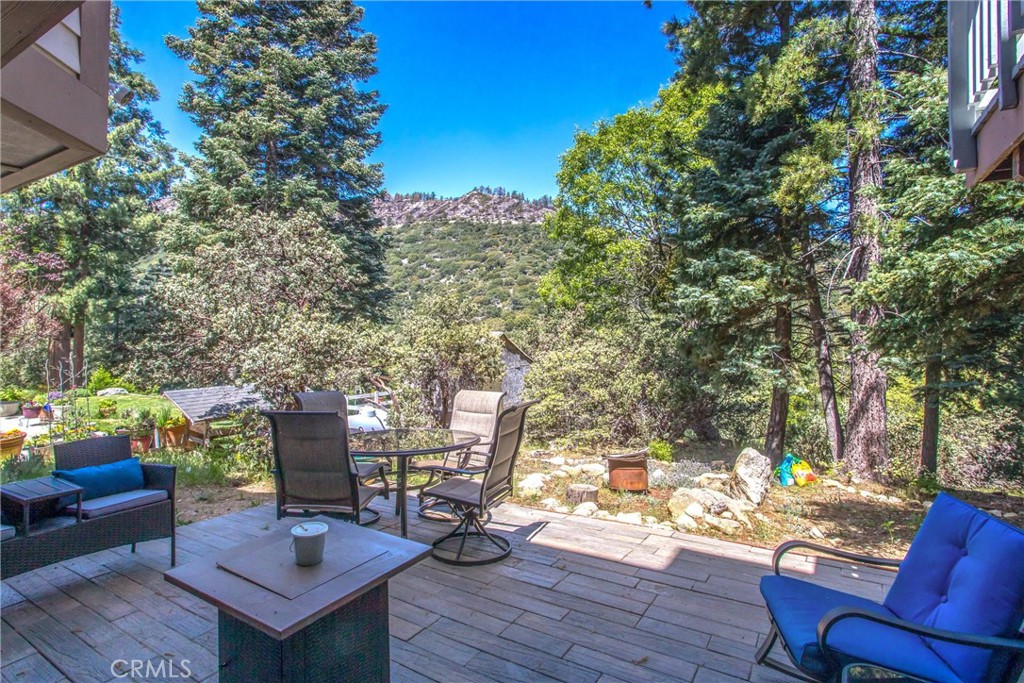 6180 Cedar Avenue Angelus Oaks, CA 92305 - Photo 28 of 31 a view of a deck with furniture and a tree