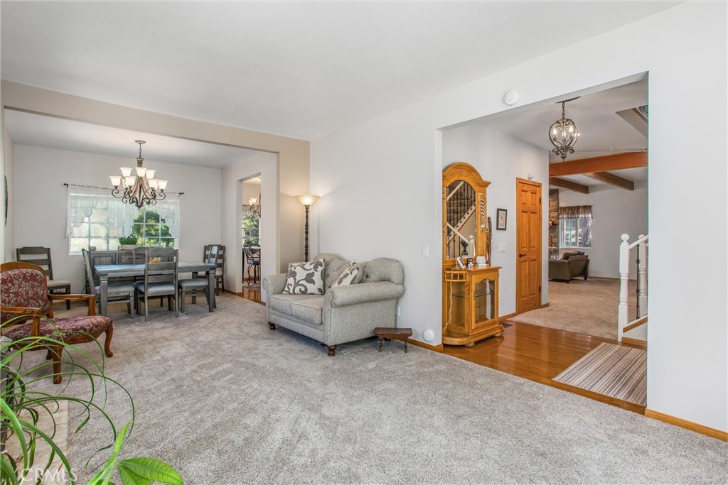 6180 Cedar Avenue Angelus Oaks, CA 92305 - Photo 6 of 31 a living room with furniture and a chandelier