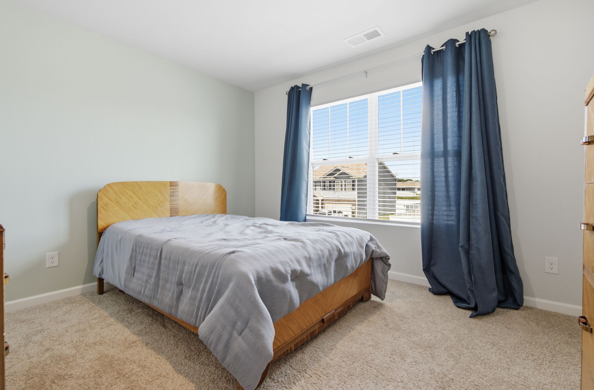 514 Ash Street Lebanon, TN 37087 - Photo 36 of 37 a bed sitting in a bedroom next to a window