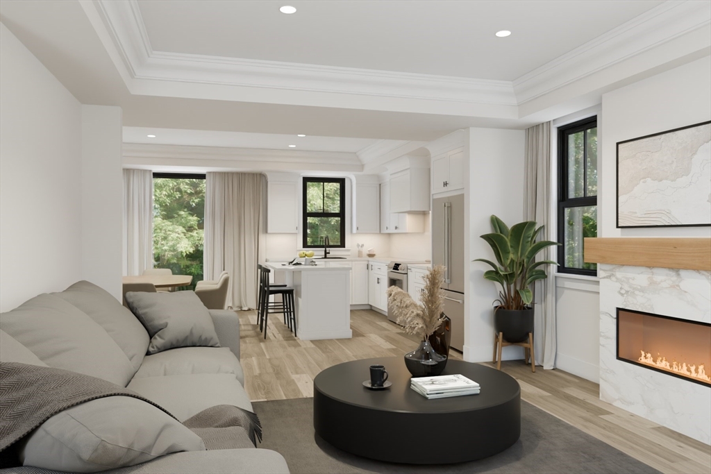 10 Webber Avenue, Unit 4D Bedford, MA 01730 - Photo 2 of 17 a living room with furniture and a fireplace