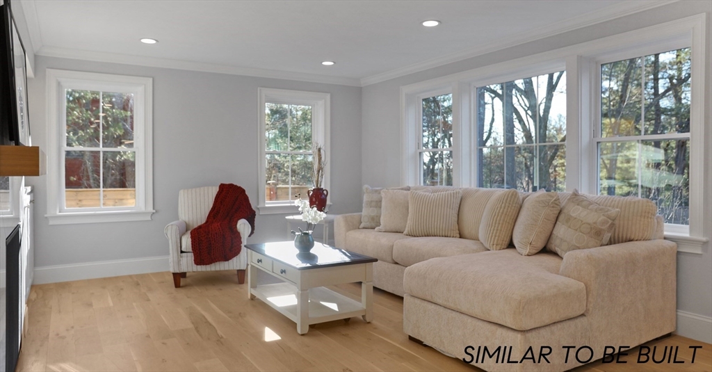 10 Webber Avenue, Unit 4D Bedford, MA 01730 - Photo 7 of 17 a living room with furniture and a large window