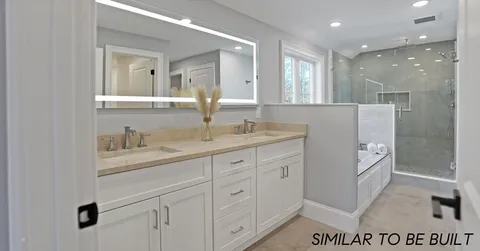 a bathroom with a sink a vanity and a mirror