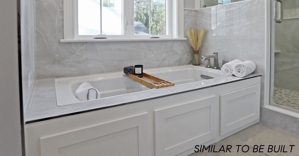 10 Webber Avenue, Unit 4D Bedford, MA 01730 - Photo 10 of 17 a close view of a sink and a vanity in the bathroom