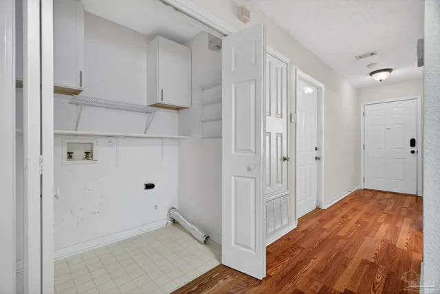 a kitchen with stainless steel appliances granite countertop a refrigerator a sink and dishwasher