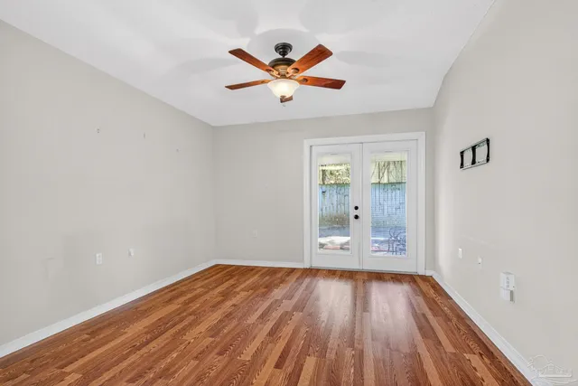 a view of a kitchen with a dishwasher cabinets and wooden floor